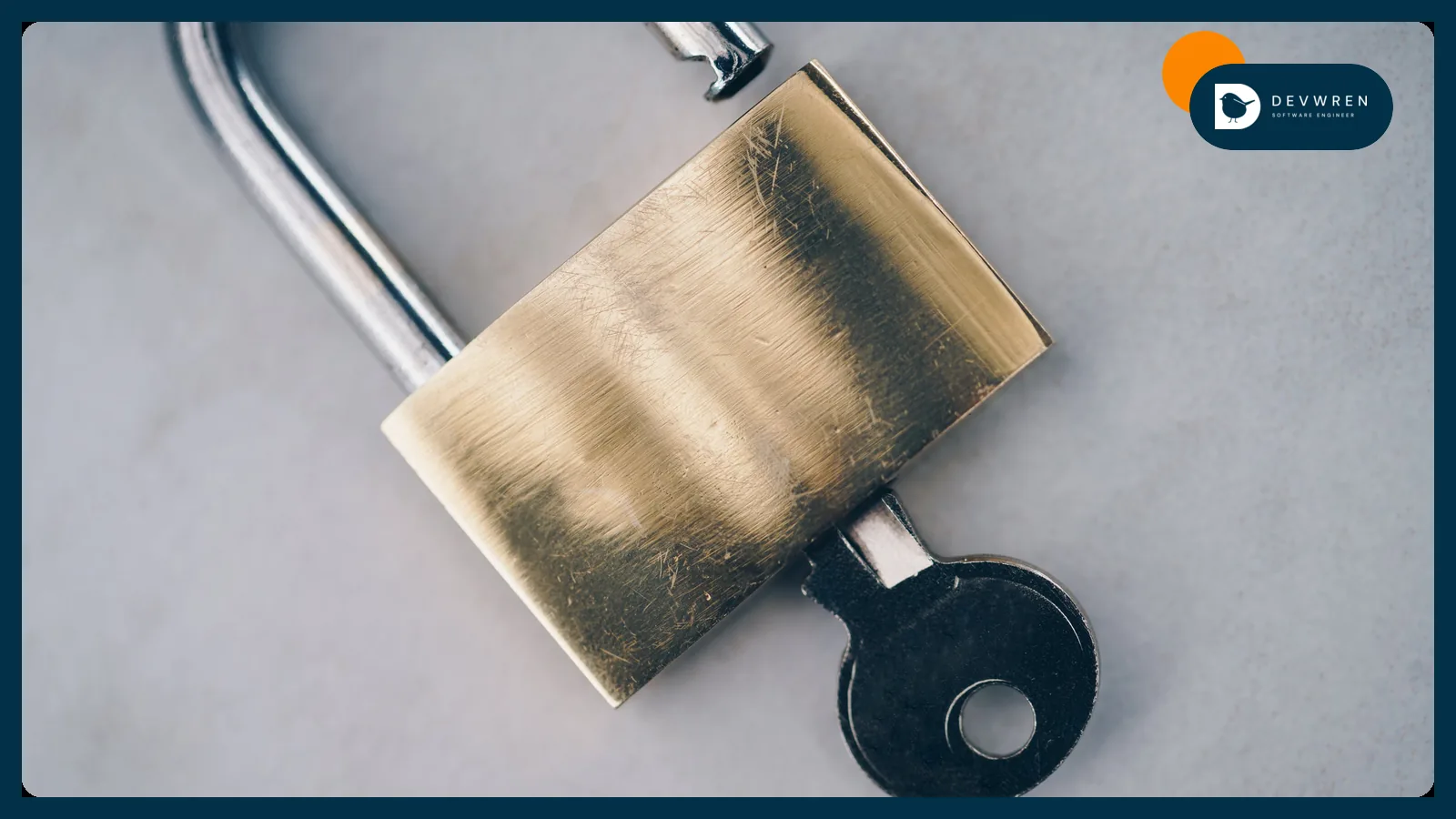 A brass padlock with its key in the lock