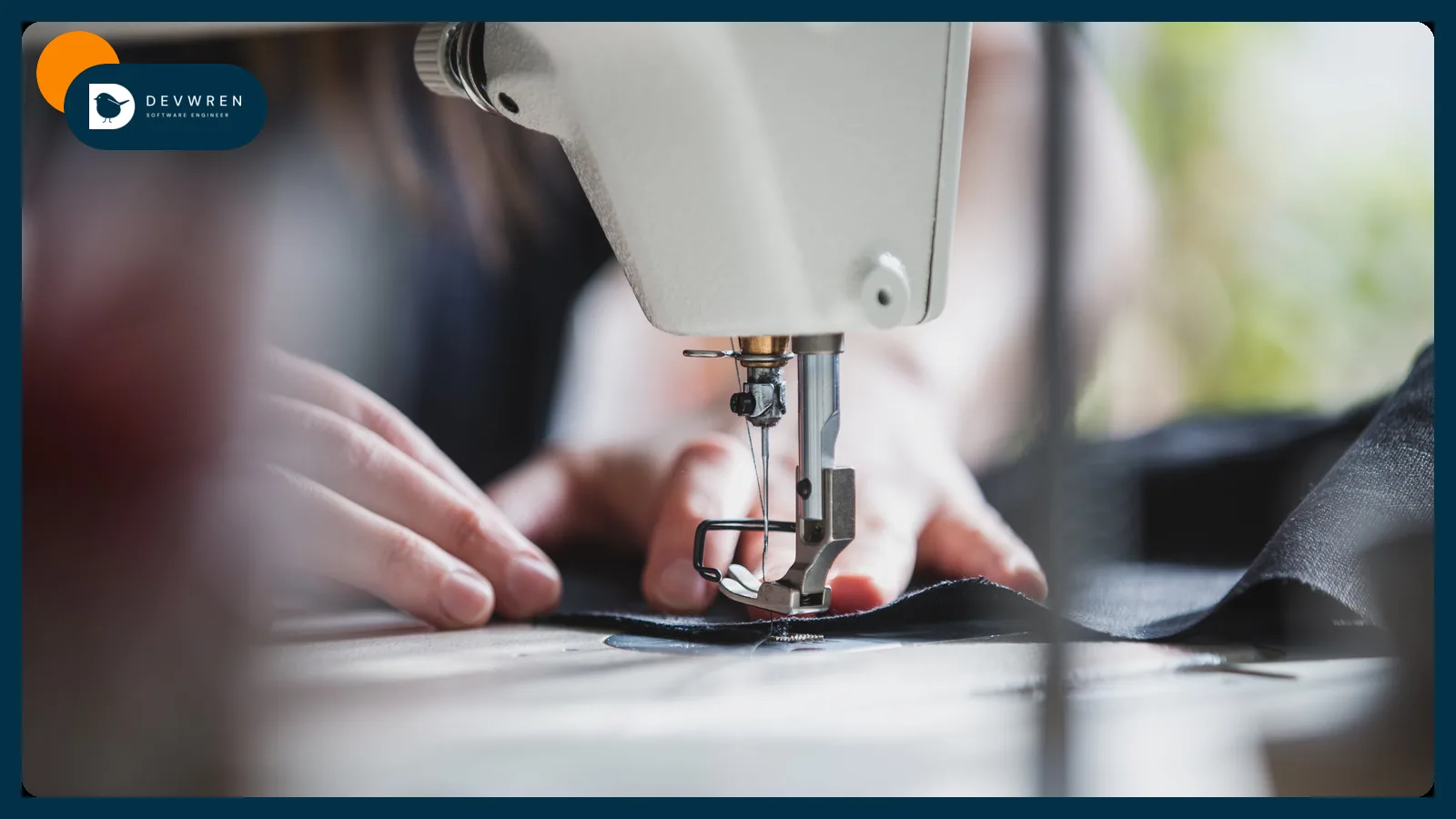 Hands guiding fabric through a sewing machine